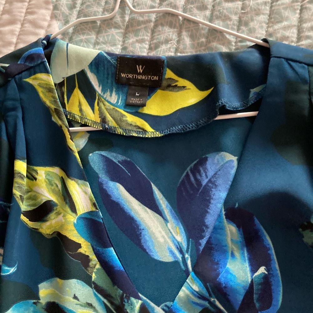 Short sleeve multi colored blouse in jewel tones.